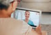 Two people participating in a telehealth session
