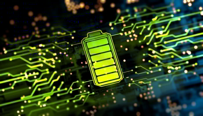 A glowing green battery icon stylized to look like part of a circuit board.