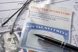 GettyImages-Social Security glasses hundred dollar bill