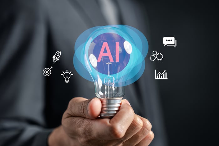 Someone holding a lightbulb with an AI bubble inside and various symbols around it.