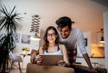 happy couple online investing stocks