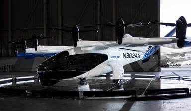 archer aviation midnight evtol aircraft in hangar with united airlines logo-ACHR-UAL