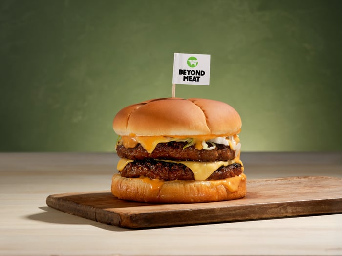 A Beyond Burger with a Beyond Meat flag in it.