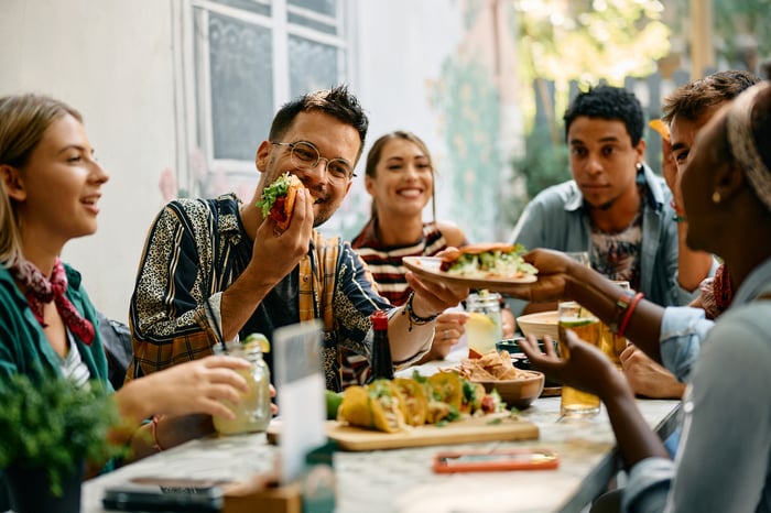 People eating together outside.