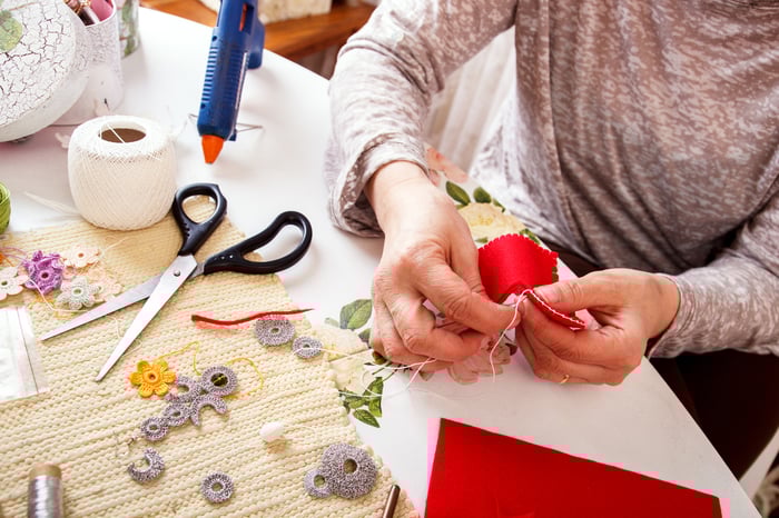 An small Etsy entrepreneur makes handmade crafts to sell on the company's marketplace.