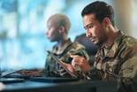 Person in the military using a tablet computer