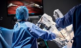 intuitive surgical davinci robot being used in an operating room_intuitive