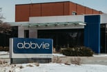abbvie_Logo_on_sign_with_building_ABBV