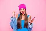 GettyCelebratingWomanPhone