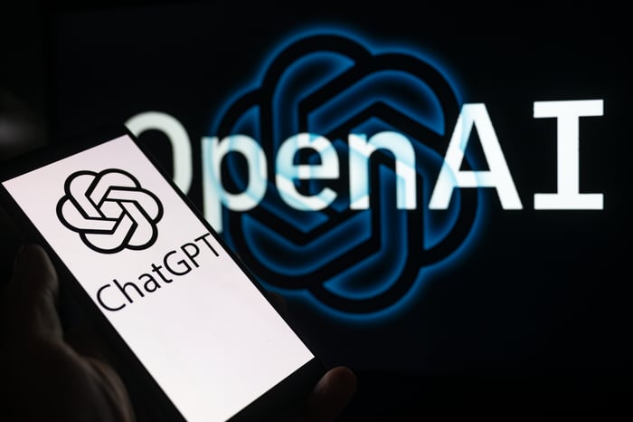 OpenAI and ChatGPT logos on mobile phone screen.