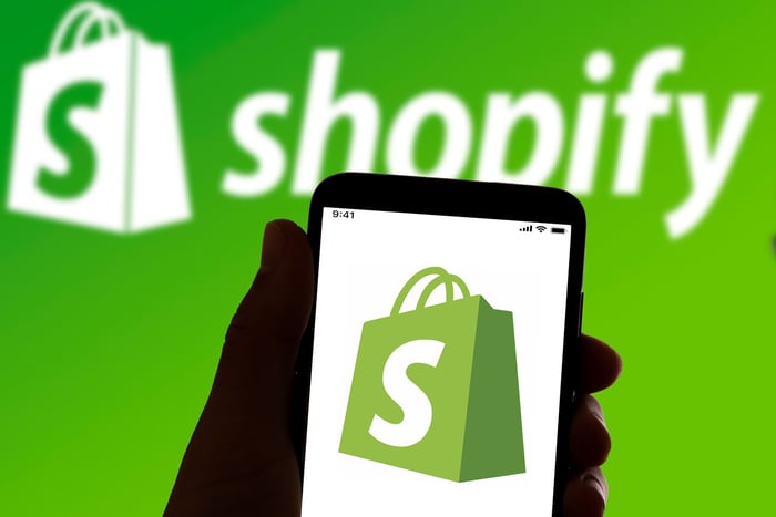 Shopify logo in a phone.