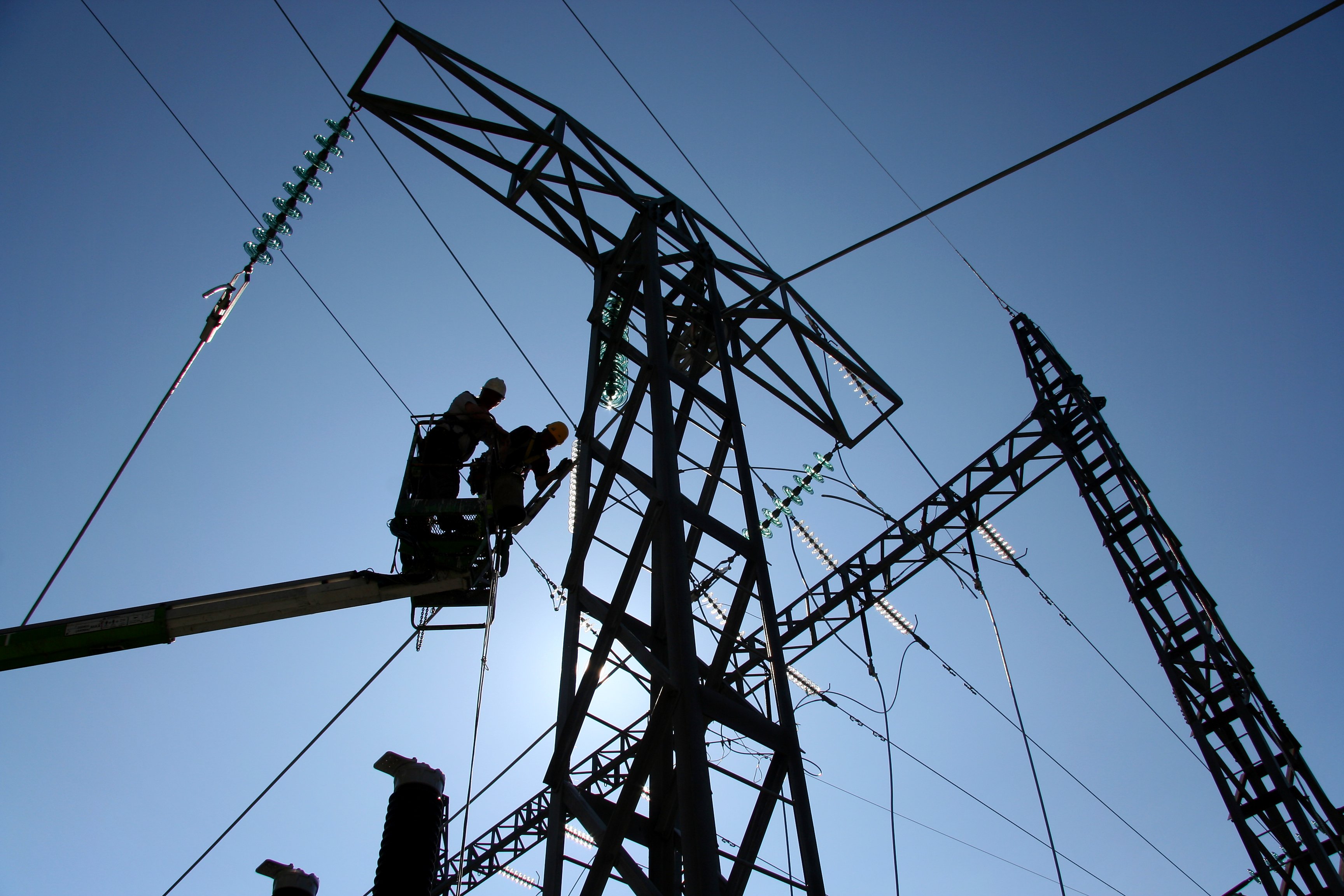 People working on power lines.