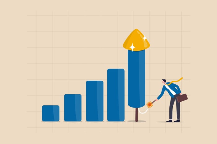 Growth chart with a person lighting a match under the last bar.