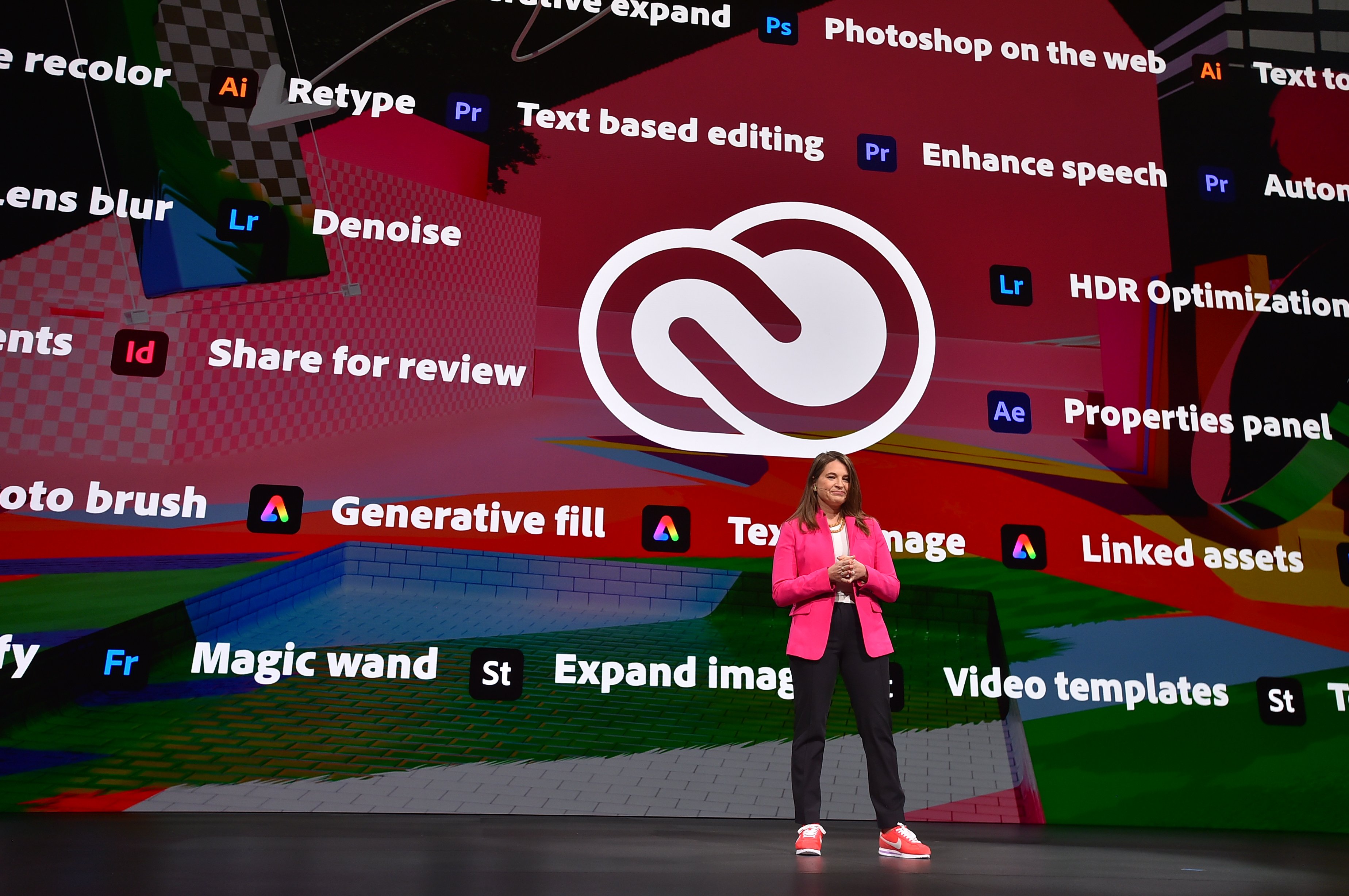 adobe presentation on stage with classic adobe logo and creative cloud features-ADBE