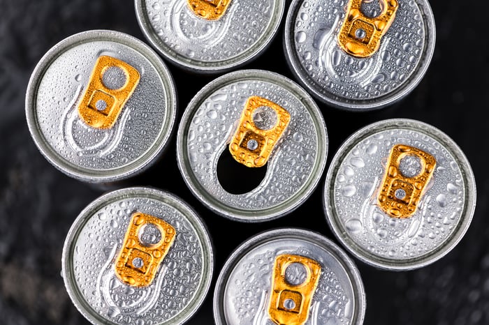 A group of pop-top beverage cans, viewed from above.