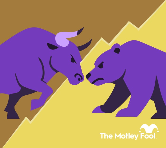 A bull and bear facing off in front of a stock chart.
