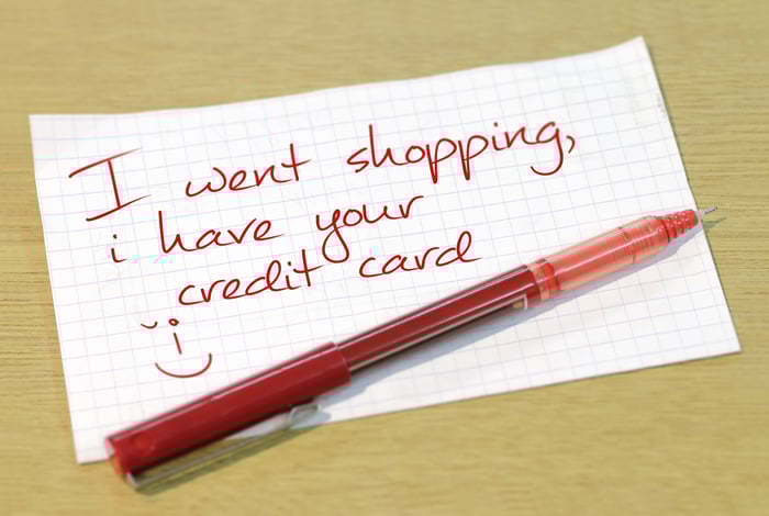 A note written in red ink that says I went shopping, I have your credit card.