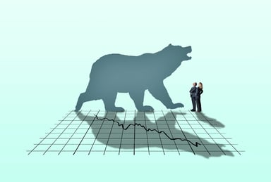 Bear silhouette against a stock market downturn chart copy