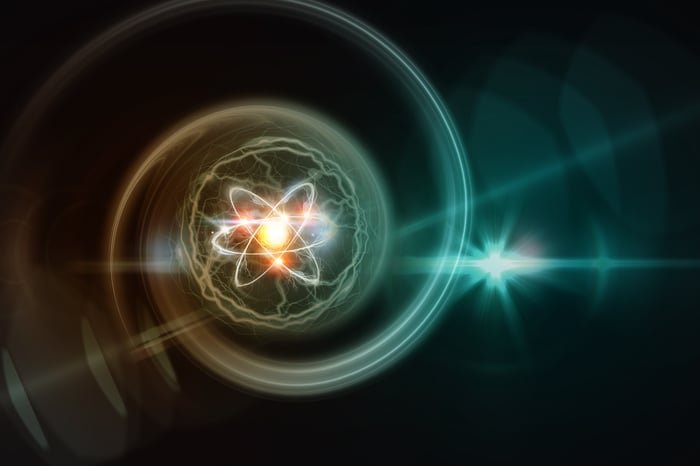 An artist's rendering of an atom on a black backdrop. 
