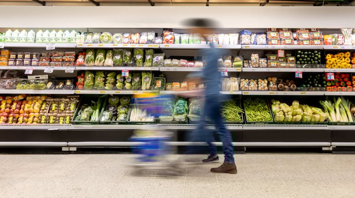 A shopper in a large grocery store.