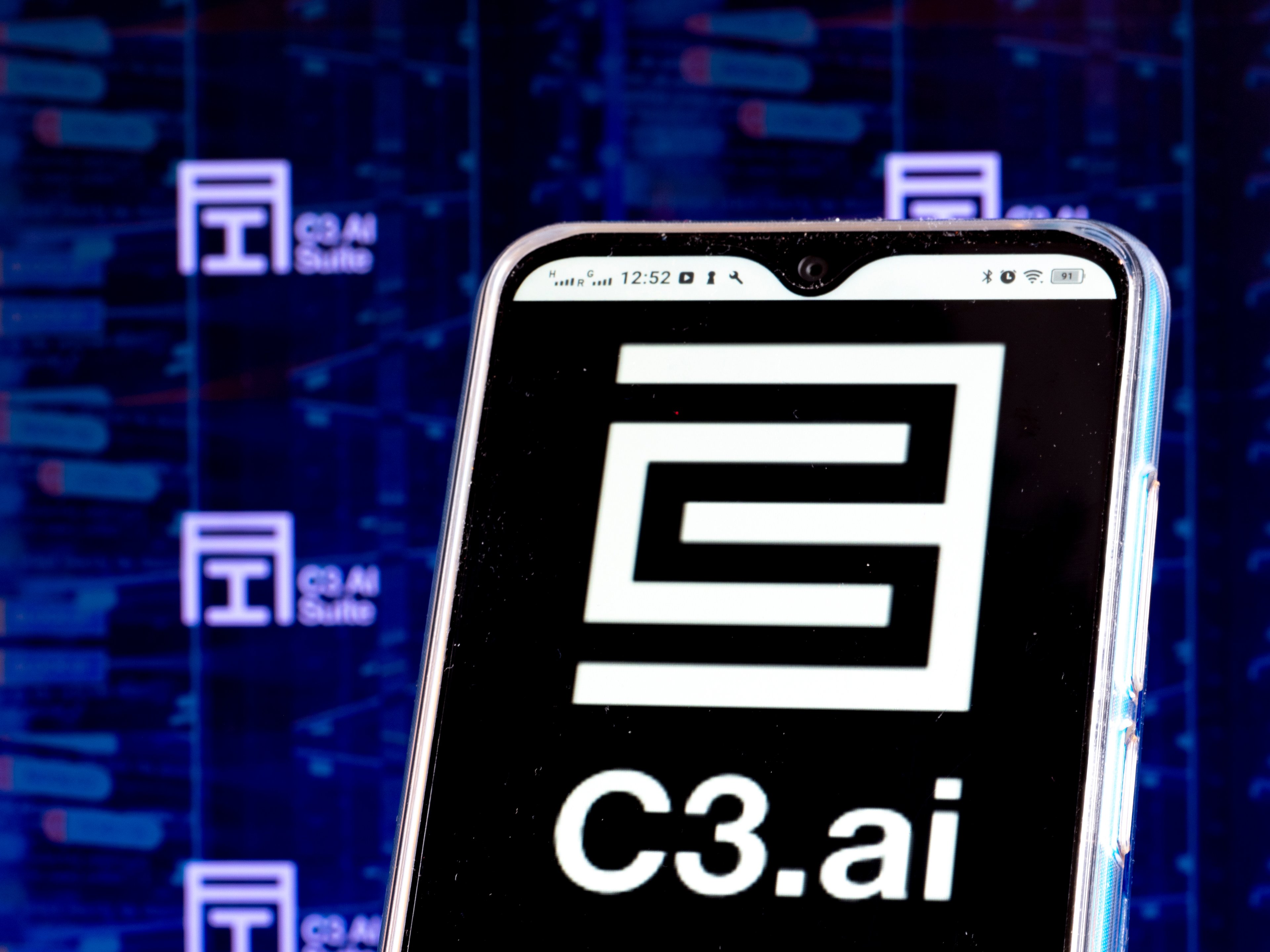 A smartphone with the C3ai logo on the screen