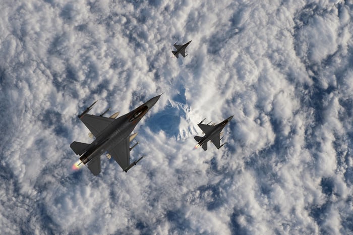 Fighter jets against a cloudy background.