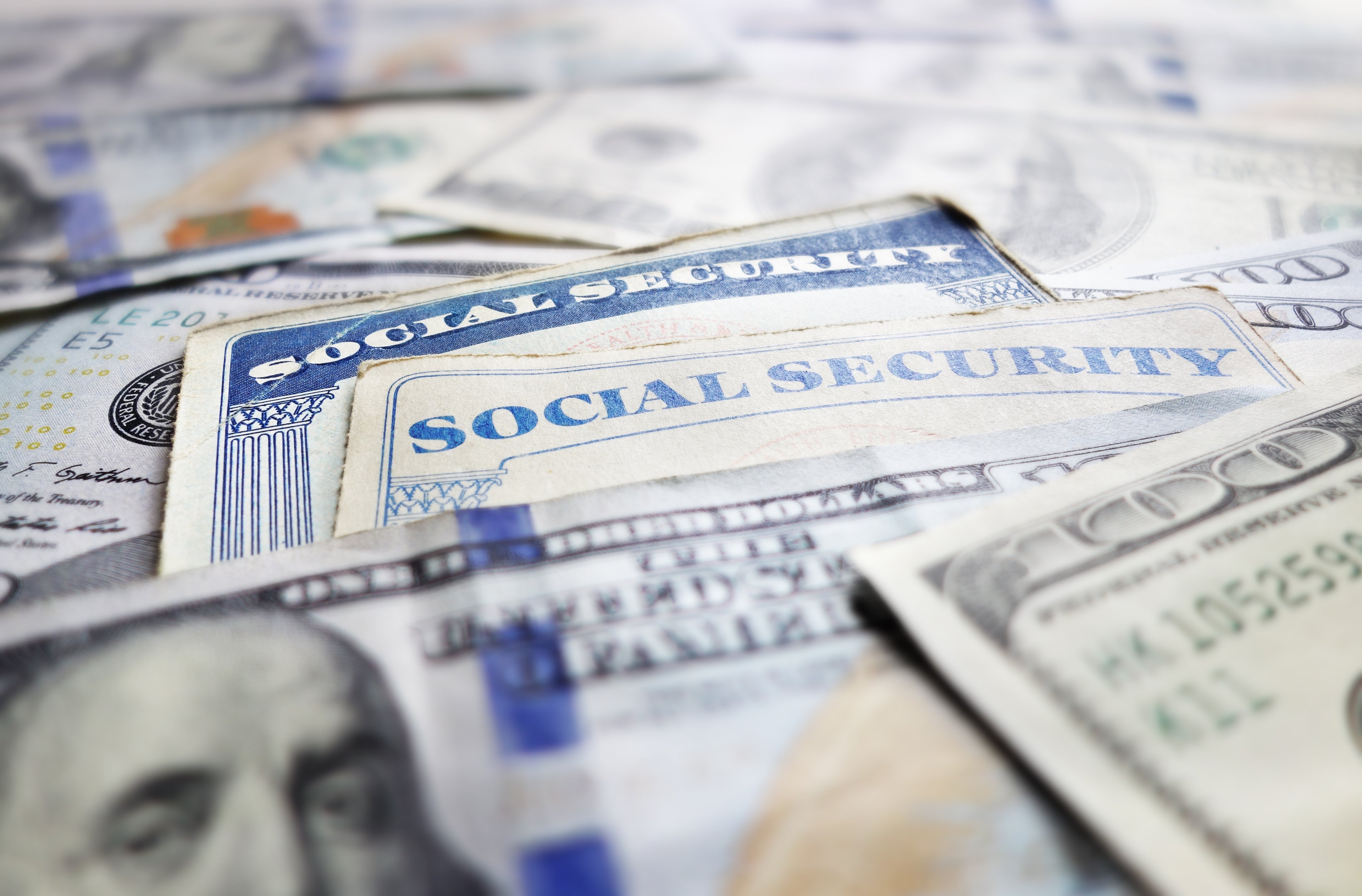 Social Security card with hundred dollar bills copy