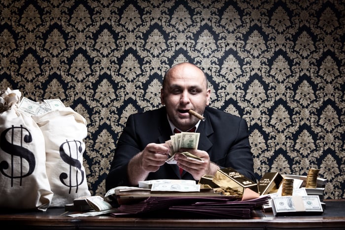 A cigar smoker counting money