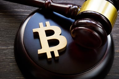 Bitcoin symbol and gavel to regulate cryptocurrencies market