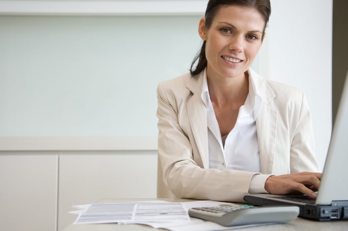 A person at a laptop.