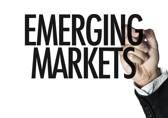 Hand pointing to the words Emerging Markets.