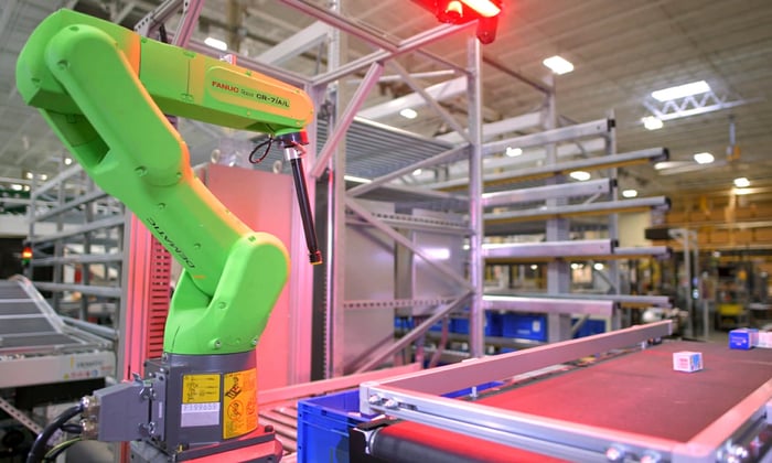 An Nvidia factory with a robotic arm on an assembly line.