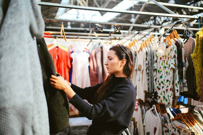 A person shops for clothes.