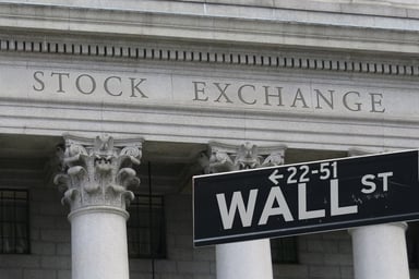 Wall Street sign in front of the New York Stock Exchange in New York City.