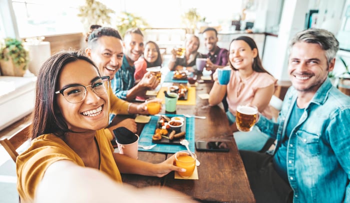 A group of people eating at a restaurant.