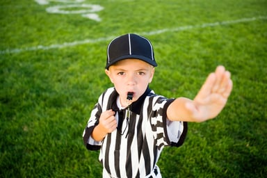 24_10_14 A child in a referee uniform putting their hand up to say stop _MF Dload GettyImages-108219895-1200x800-5b2df79