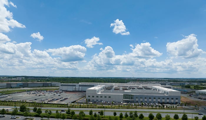 An aerial view of a data center on a sunny day.