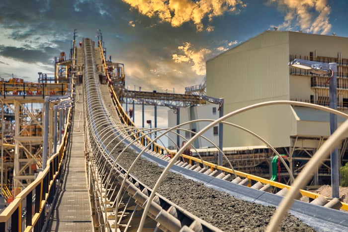 Conveyer bringing ore to a refinery operation.