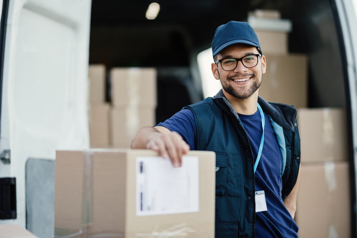 Getty - smiling worker next to boxes-1200x800-5b2df79