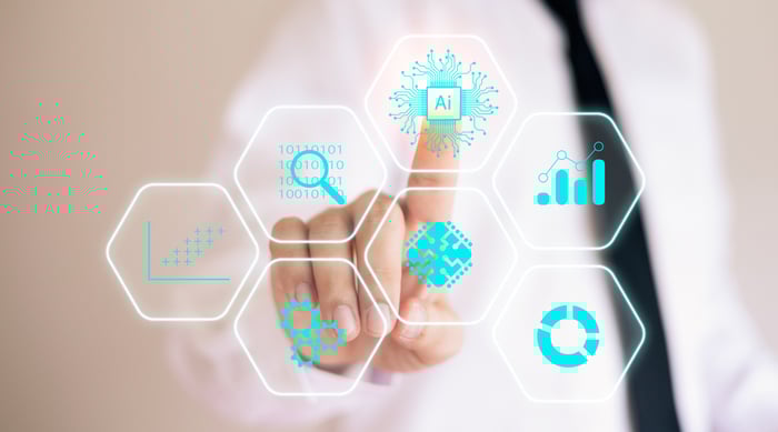 A finger taps a digital AI icon.