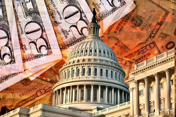 U.S. Capitol backed by $50 bills. 