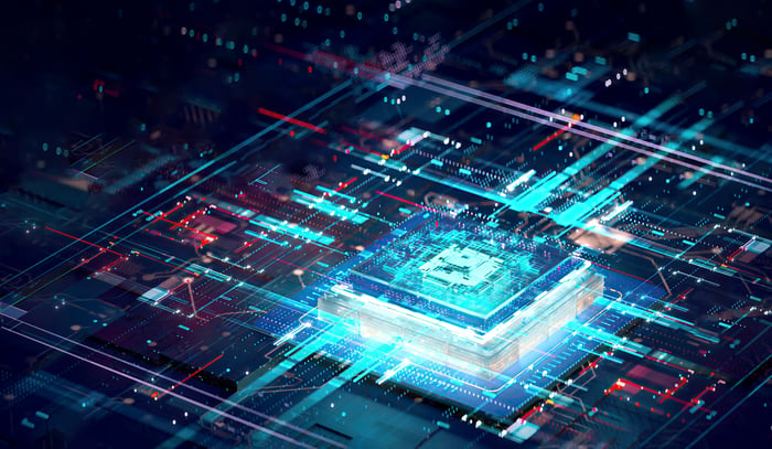 A computer chip surrounded by complex lights and grids.