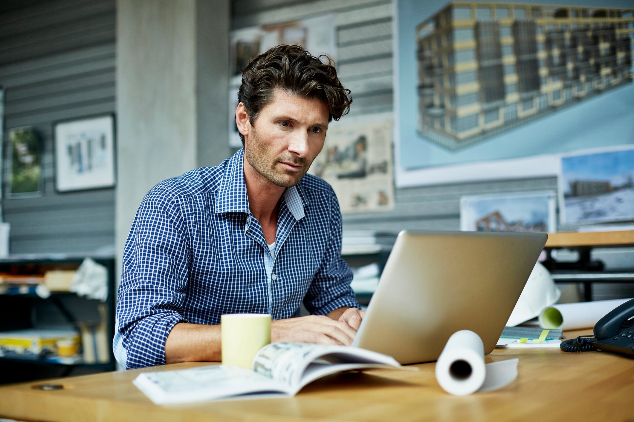 Man 40s laptop concentrating GettyImages-481292775