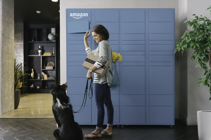 A person with a dog at an Amazon locker.