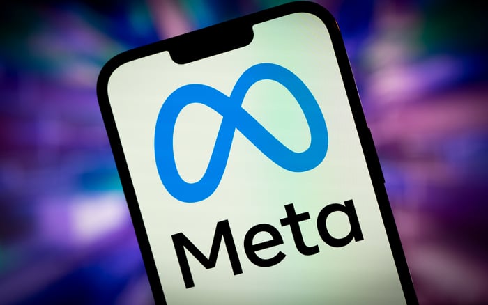 Meta name and logo displayed on a smartphone.