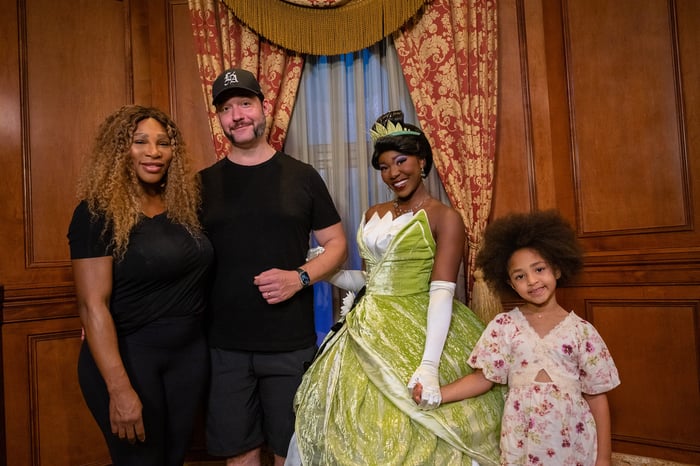 Serena Williams and her family meeting Tiana at Disney World.