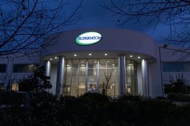 SMCI stock - Getty Images - supermicro headquarters building at night with illuminated supermicro logo sign-SMCI