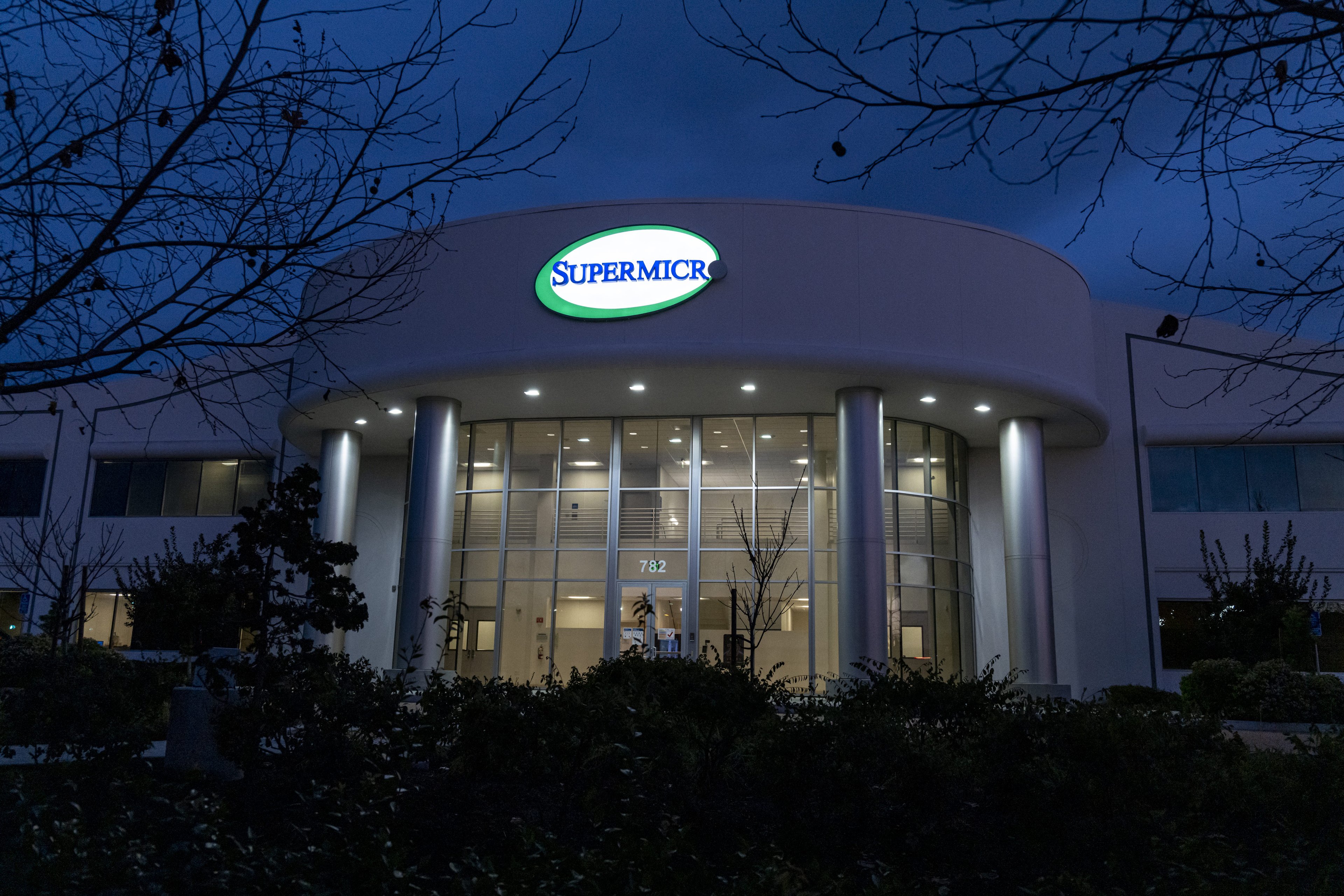 SMCI stock - Getty Images - supermicro headquarters building at night with illuminated supermicro logo sign-SMCI