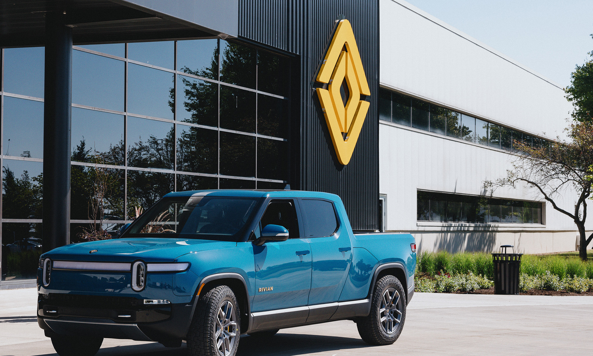 truck in front of building with _rivian logo_rivian_
