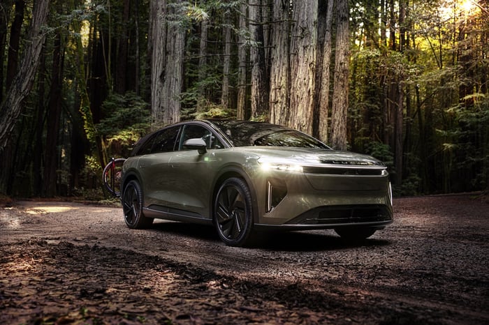 An SUV in the woods.